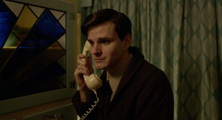 A still image from the short film Phonetime depicting the character Peter holding a rotary dial phone to his ear